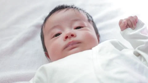 The baby boy sleeping on the bed Stock Footage 327848287