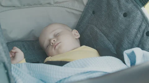 Baby boy sleeping in his stroller 1 Stock Footage 264570710