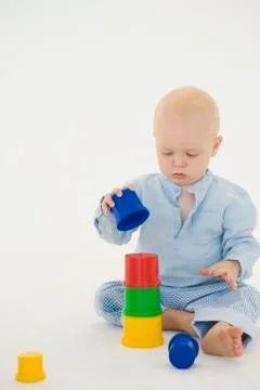 Baby boy stacking blocks Stock Photos