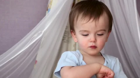 A Baby Boy Standing in Cot Stock Footage 61878557