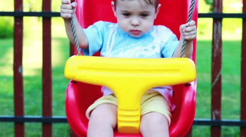 Baby boy in a swing 스톡 동영상 24671326