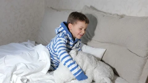 Baby boy with teddy bear getting ready go sleep in bed Stock Footage 151929124