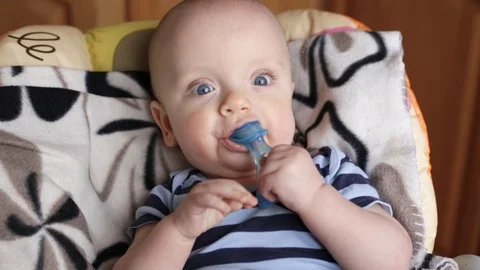Baby boy with teether Stock Footage 106194007