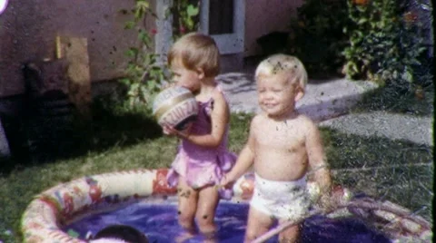 Baby Boys Play in Backyard Kiddie Pool 1... | Stock Video