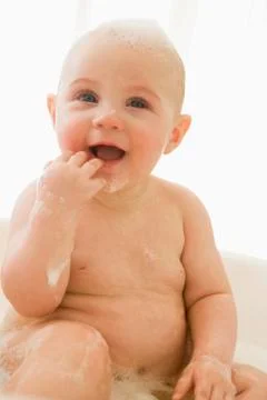 Baby in bubble bath Stock Photos
