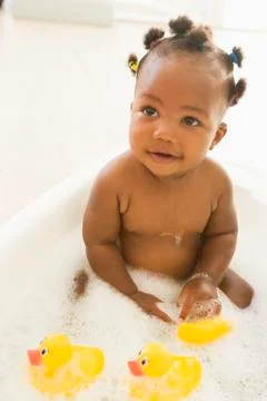Baby in bubble bath Stock Photos