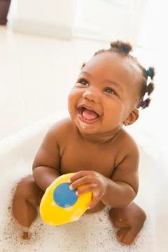 Baby in bubble bath Stock Photos