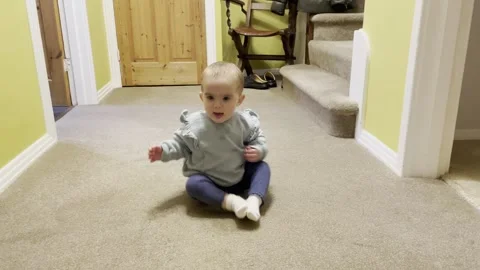 Baby bum shuffling and exploring. Stock Footage 260317635