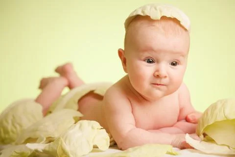 Baby in cabbage Stock Photos