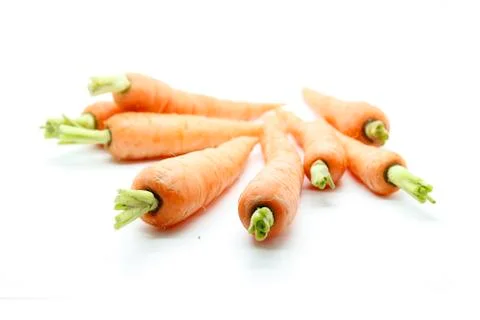 Baby carots exploded pattern on white background Foto stock