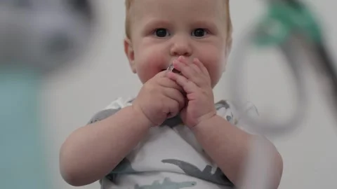 Baby chewing pacifier Stock Footage 290904365