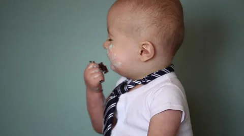Baby closeup eating cake Stock Footage 61925702