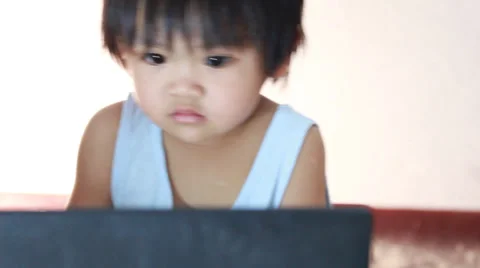 Baby with computer Stock Footage 38427321