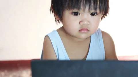 Baby with computer Stock Footage 38428871