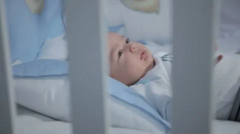Baby is on a cot - closeup Stock Footage 46105884