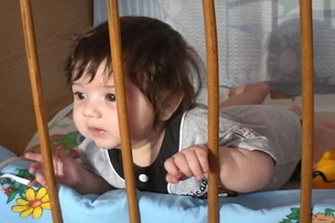 Baby in cot. Stock Footage 8679326