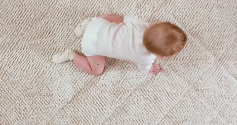 Baby crawling on the blanket Stock Footage 147927382