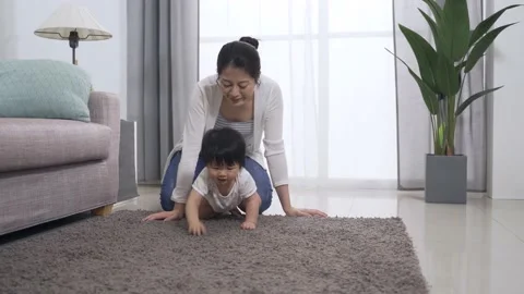 Baby crawling slowly on the carpet Video stock 200452008