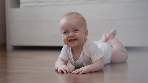 Baby crawls on the floor Stock Footage 124426413