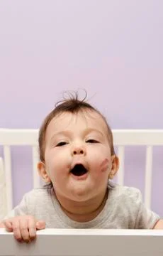 Baby in crib Stock Photos