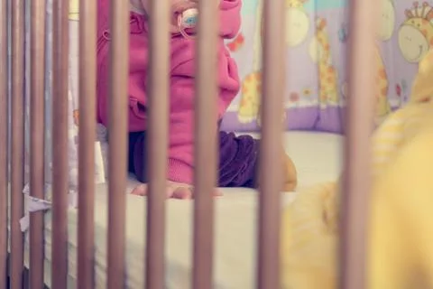 Baby in a crib. Stock Photos