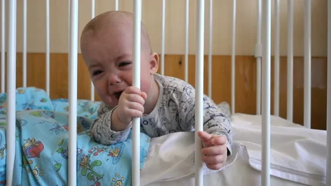 The baby cries in a bed Stock Footage 86191634