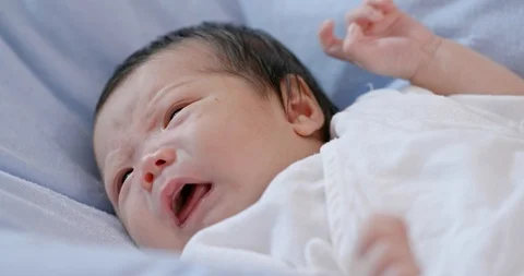 Baby cry on bed Stock Footage 101118348