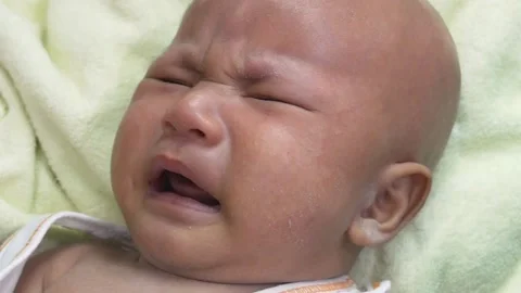 Baby crying on bed 스톡 동영상 156010356
