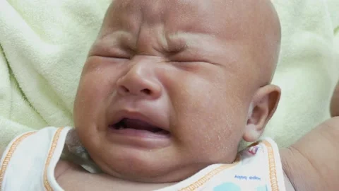 Baby crying on bed 스톡 동영상 156010431