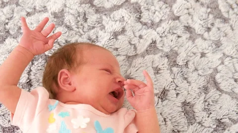 Baby is crying on the bed. selective focus. Stock Footage 267847628