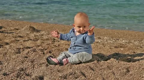 Baby dancing on the beach Stock Footage