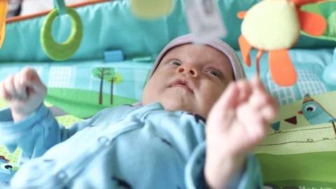 Baby on a developing rug Stock Footage 98131162