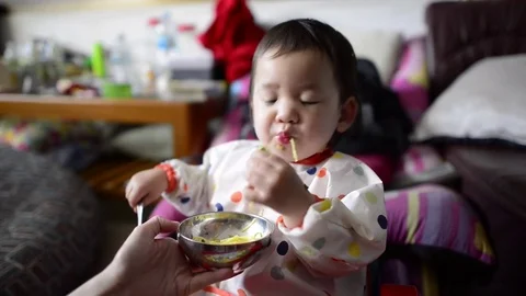 Baby dinner time Stock Footage