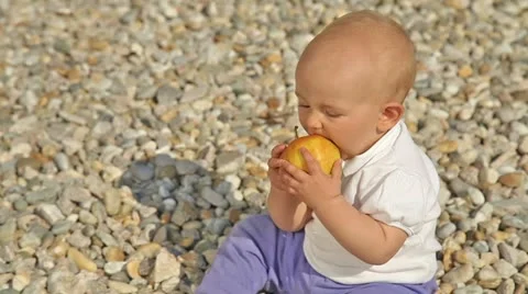 Baby doesn't like apple Stock Footage 21239886