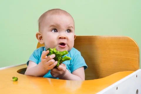 Baby doesn't like broccoli Stock Photos