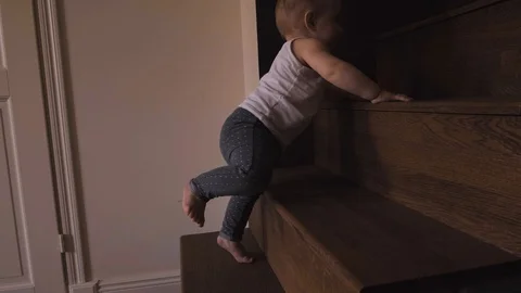 Baby Doing First Steps On Stairs Stock-Footage 114770157