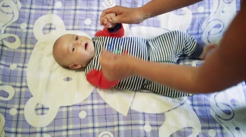 Baby doing massage Stock Footage 64655872