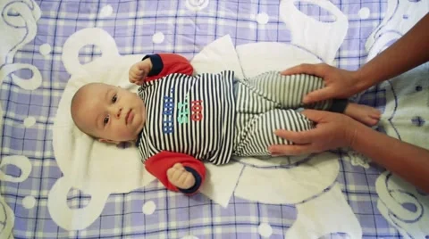 Baby doing massage Stock Footage 64655890