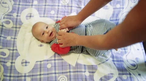 Baby doing massage Stock Footage 64655918