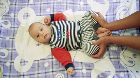 Baby doing massage Stock Footage 64655942