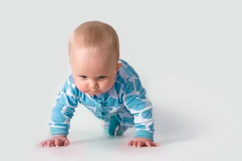 Baby doing push-ups Stock Photos