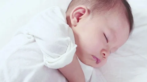 Baby dozing on the bed Video stock 76633329