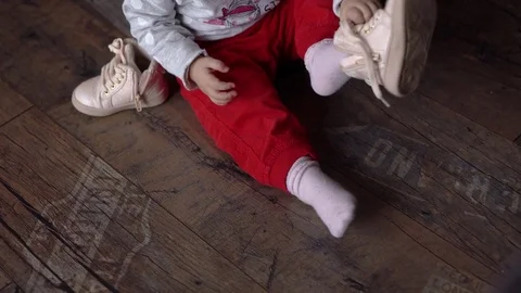 Baby dressing up Stock Footage 73336209