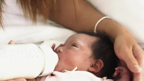 Baby drinking milk form bottle milk Stock Footage 263614842