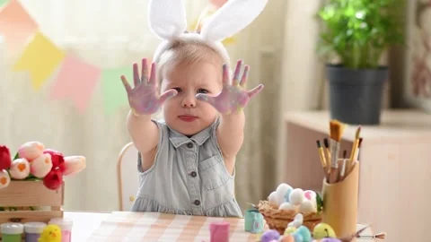 Baby in the Easter decor Stock Footage 175516793
