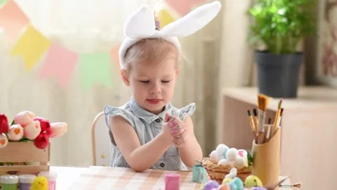 Baby in the Easter decor Stock Footage 175516865