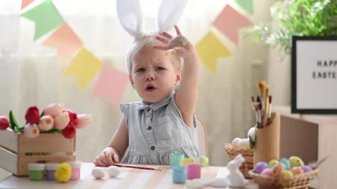 Baby in the Easter decor Stock Footage 175516896
