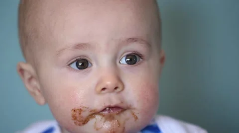 Baby eating cookie Stock Footage 61926099