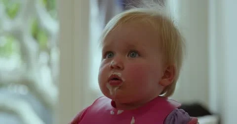 Baby eating dinner Stock Footage 12575201