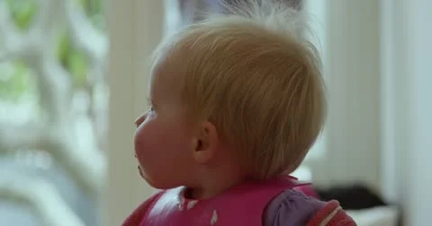 Baby eating dinner Stock Footage 12575806